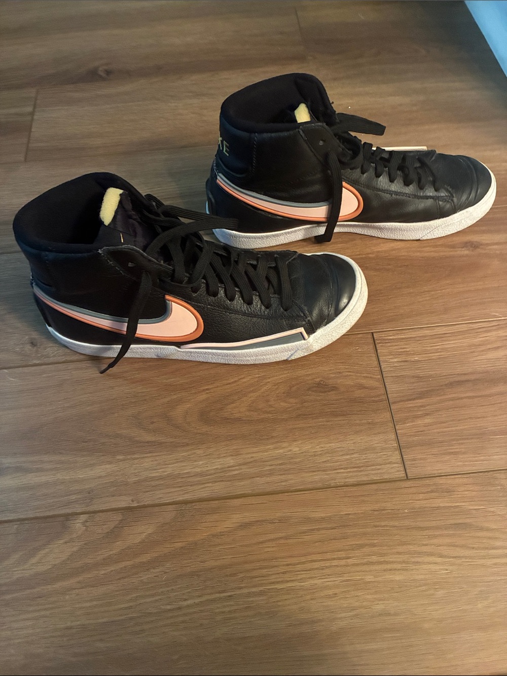 Nike Black High-Top Sneakers with Peach Swoosh